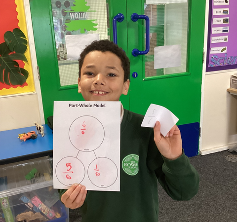 11 Faizan from Rowan Primary School in Coseley shows off his amazing fraction work!