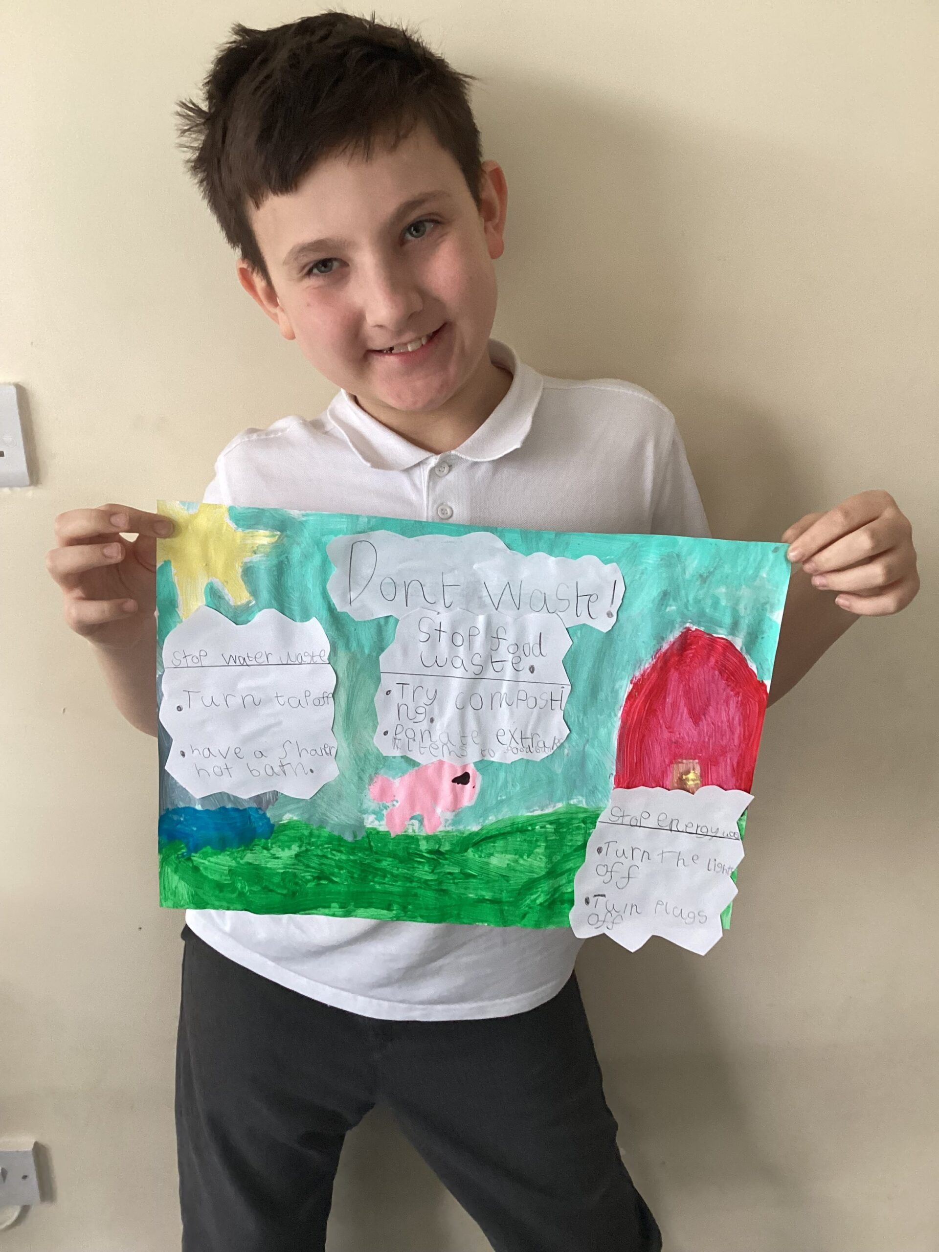 Rowan School learners proudly displaying their sustainability posters during Topic Week, raising awareness about reducing waste and saving energy.