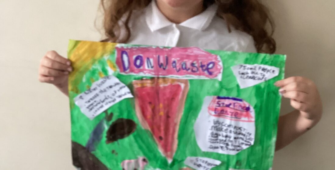 Learners at Rowan School presenting their persuasive sustainability posters, designed to promote responsible waste reduction across the school.