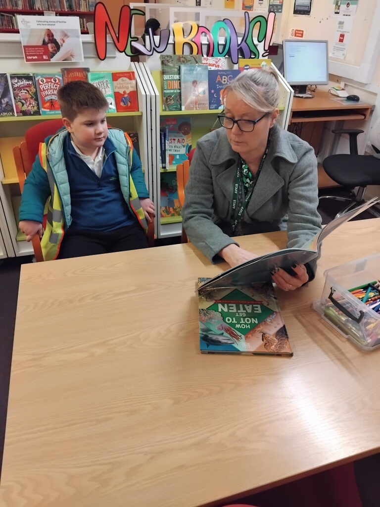 Rowan School Oak Class enjoying reading and sharing books after a library trip.