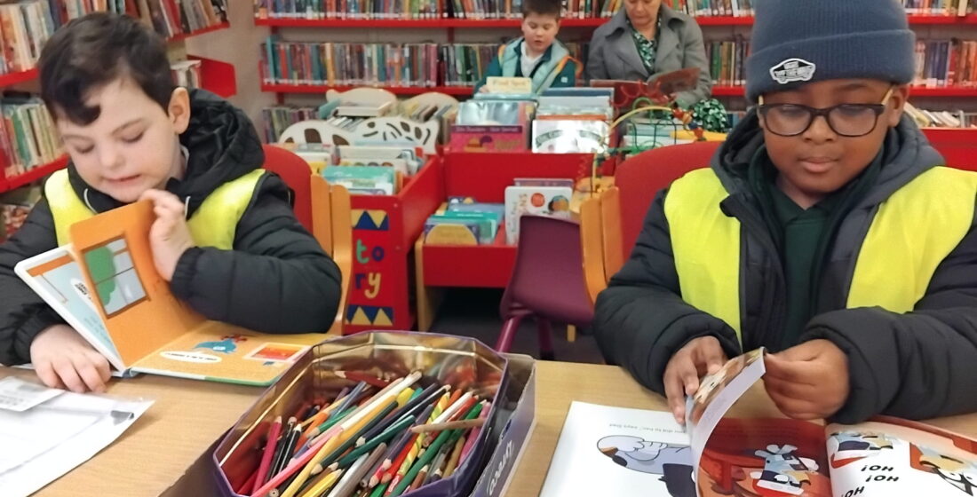 Children from Oak Class developing a love of reading on a school library excursion.
