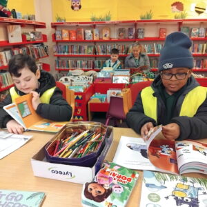 Children from Oak Class developing a love of reading on a school library excursion.