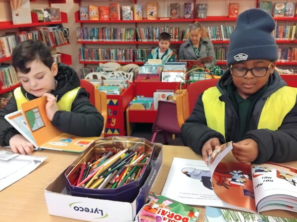 Children from Oak Class developing a love of reading on a school library excursion.