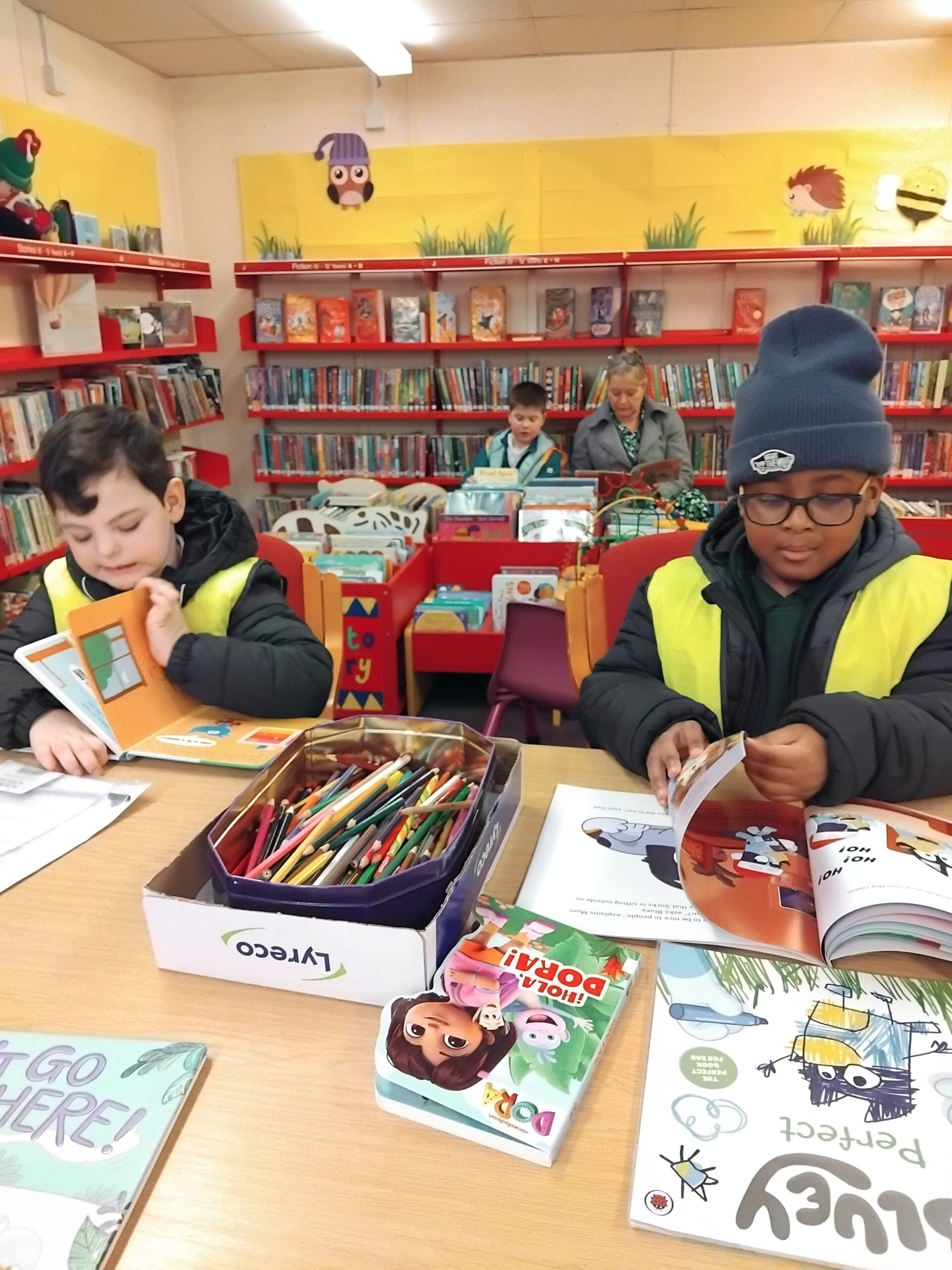 Children from Oak Class developing a love of reading on a school library excursion.