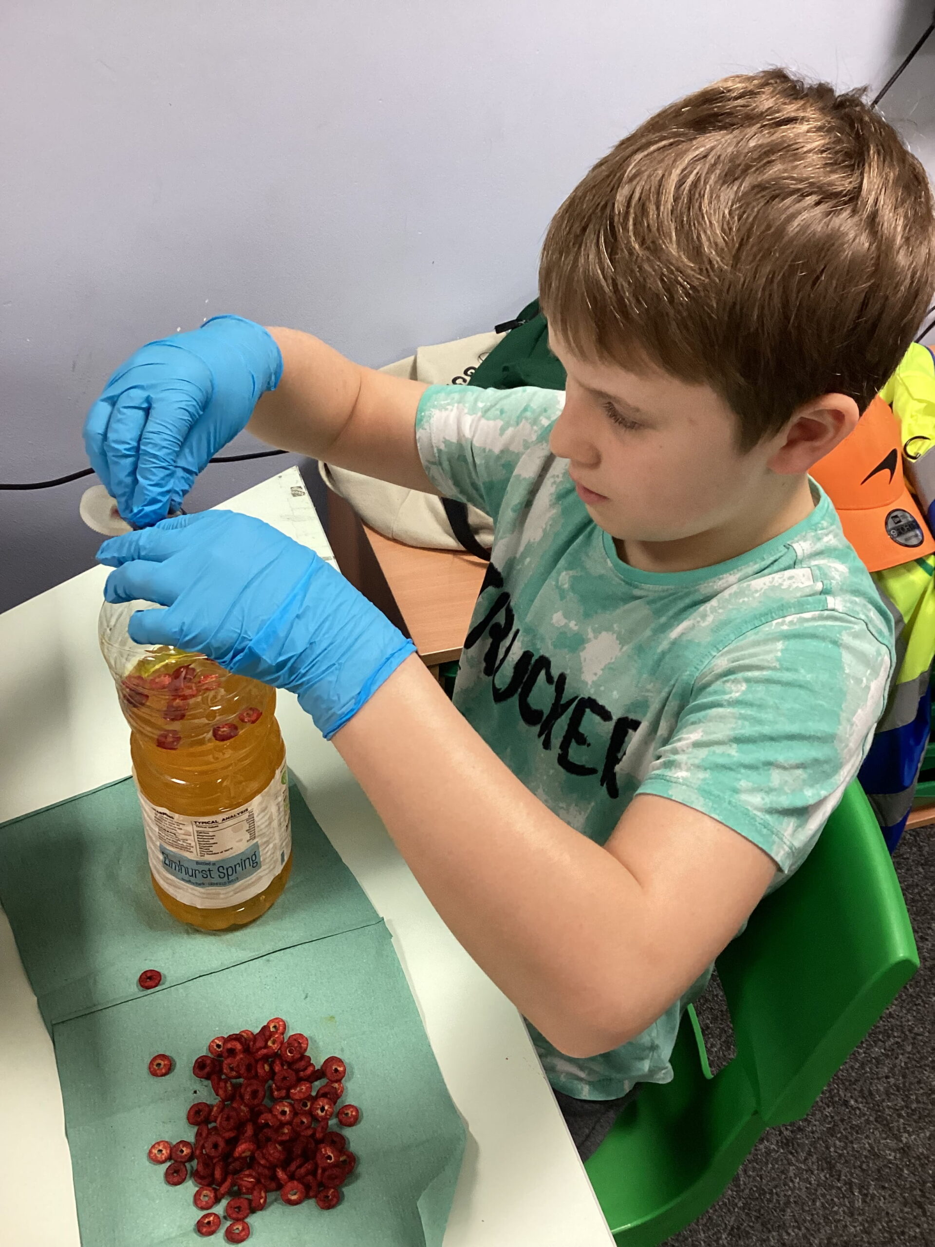 Children using Cheerios, marshmallows, and pom-poms to represent blood cells.