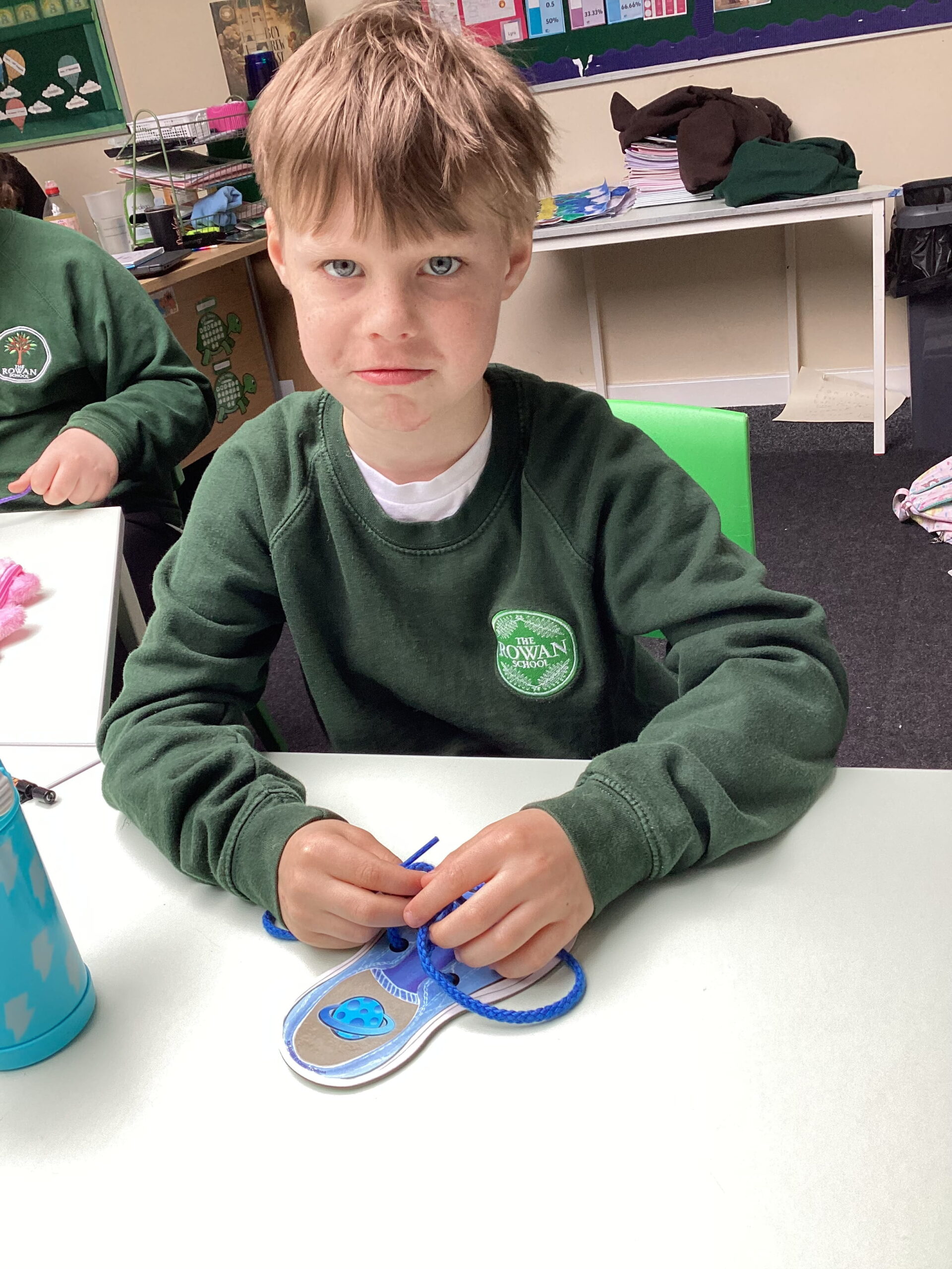 Maple Class develops practical life skills by learning to tie shoelaces, improving hand-eye coordination, perseverance and independence at The Rowan School.