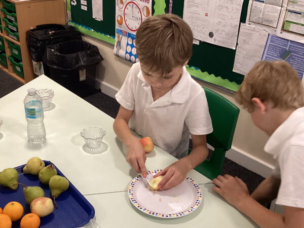 Elm Class enjoys a refreshing fruit salad after learning valuable life skills through practical cooking and healthy eating activities at The Rowan School.